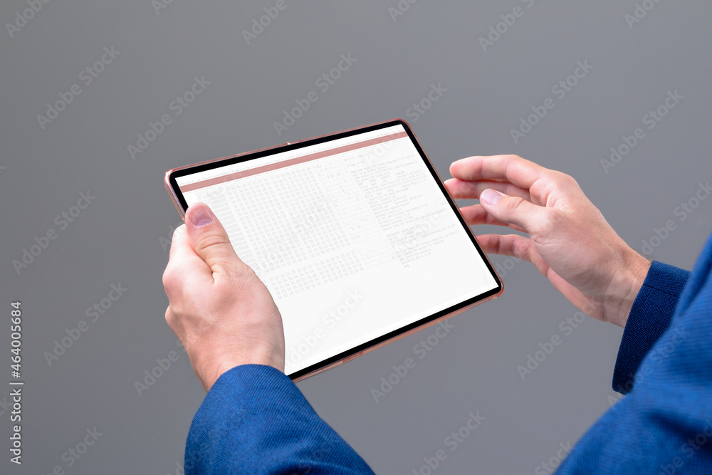 Hands of caucasian male programmer using tablet with coding on screen Hands of caucasian male programmer using tablet with coding on screen