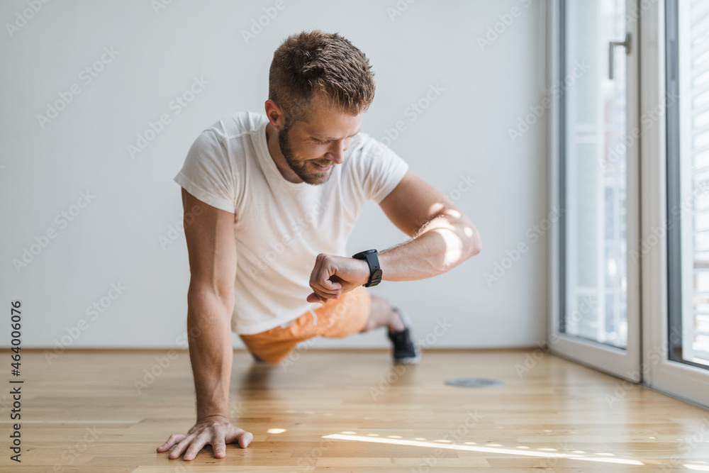 Handsome man working out at home Handsome man working out at home