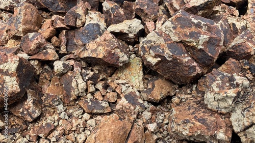 Chipped rubble stone. Crimson Quartzite. Random pieces of red stones used in interior, exterior, landscape design.