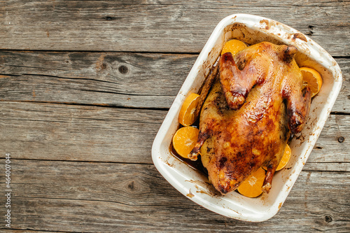 Roast duck with oranges in baking dish, Dish for Christmas Eve. banner, menu, recipe place for text, top view