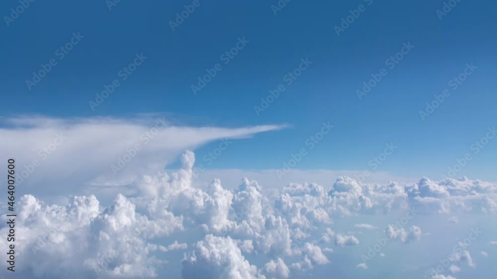 Flying through beautiful thick fluffy clouds. Close-up video of white big clouds on a blue sunny sky. Amazing timelapse of soft white clouds moving slowly on the clear blue sky in pure daylight. Flying through beautiful thick fluffy clouds. Close-up video of white big clouds on a blue sunny sky. Amazing timelapse of soft white clouds moving slowly on the clear blue sky in pure daylight.