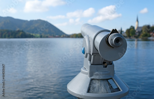 Telescope at the waterfront of lake Schliersee in Bavaria, Germany