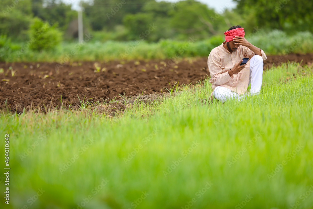 Young indian farmer in depression. Stock Photo | Adobe Stock
