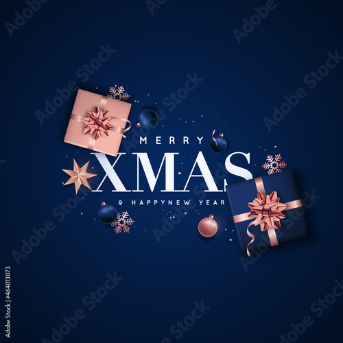 Merry Xmas and Happy New Year. Background Christmas design of rose gold and blue balls, gift boxes, star, snowflakes. Flat lay top view. Christmas greeting cards, web sites, social media.