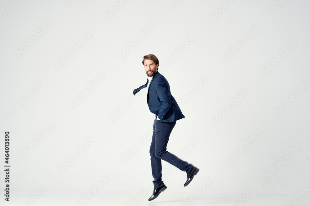 business man in a suit emotions jumping full height Victory business man in a suit emotions jumping full height Victory