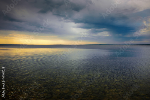 Fototapeta Naklejka Na Ścianę i Meble -  Amazing dramatic landscape. Dramatic dark clouds during sunset at sea.