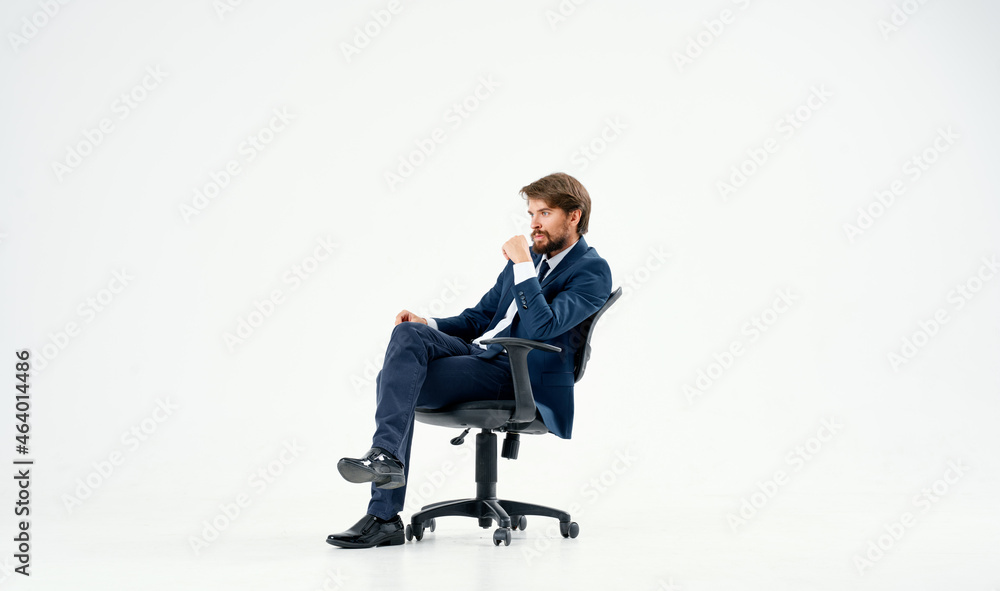 business man in a suit sitting in a chair emotions studio business man in a suit sitting in a chair emotions studio