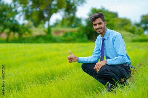 Indian agronomist at green onion agriculture field
