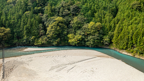 Curved jade-colored river and white sandbar