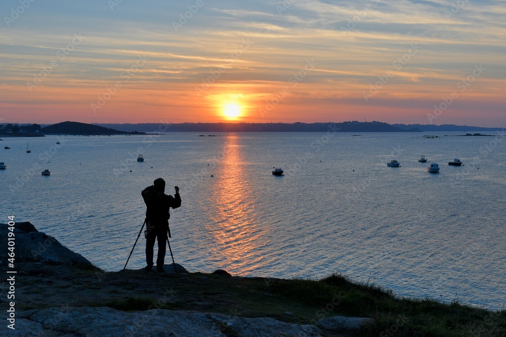 photographer at sunset in Brittany France