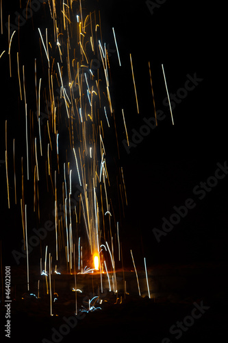 Long exposure of flower pot firecracker burning during the Diwali festival in India. Diwali festival background, People enjoying the diwali festival by burning firecrackers