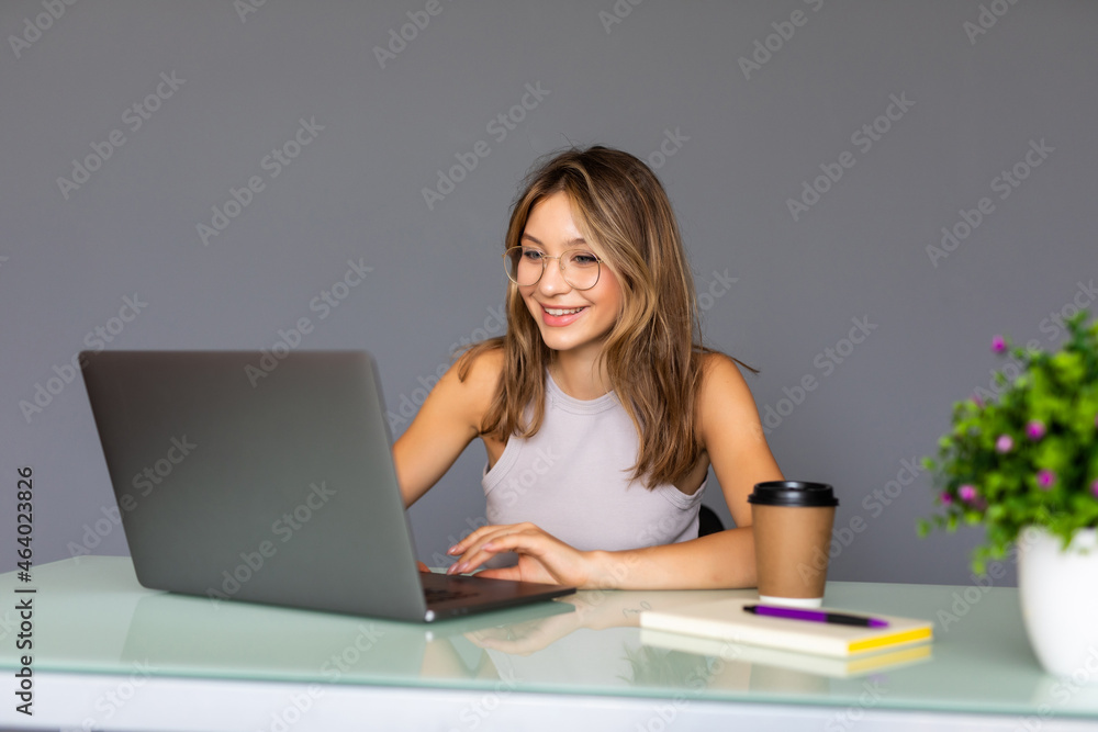 Portrait of a businesswoman using laptop in office Portrait of a businesswoman using laptop in office