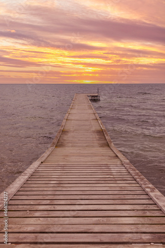 Wooden jetty at the Baltic Sea coast of Lolland, Denmark in sunset
