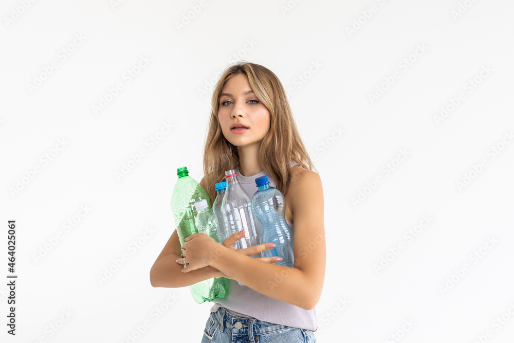 Beautiful woman hold plastic bottles carry trash recycling service irresponsible people human isolated on white background Beautiful woman hold plastic bottles carry trash recycling service irresponsible people human isolated on white background