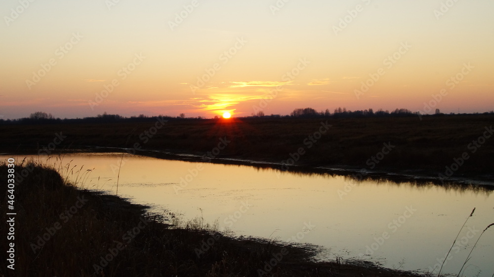 Fototapeta premium sunset over the river
