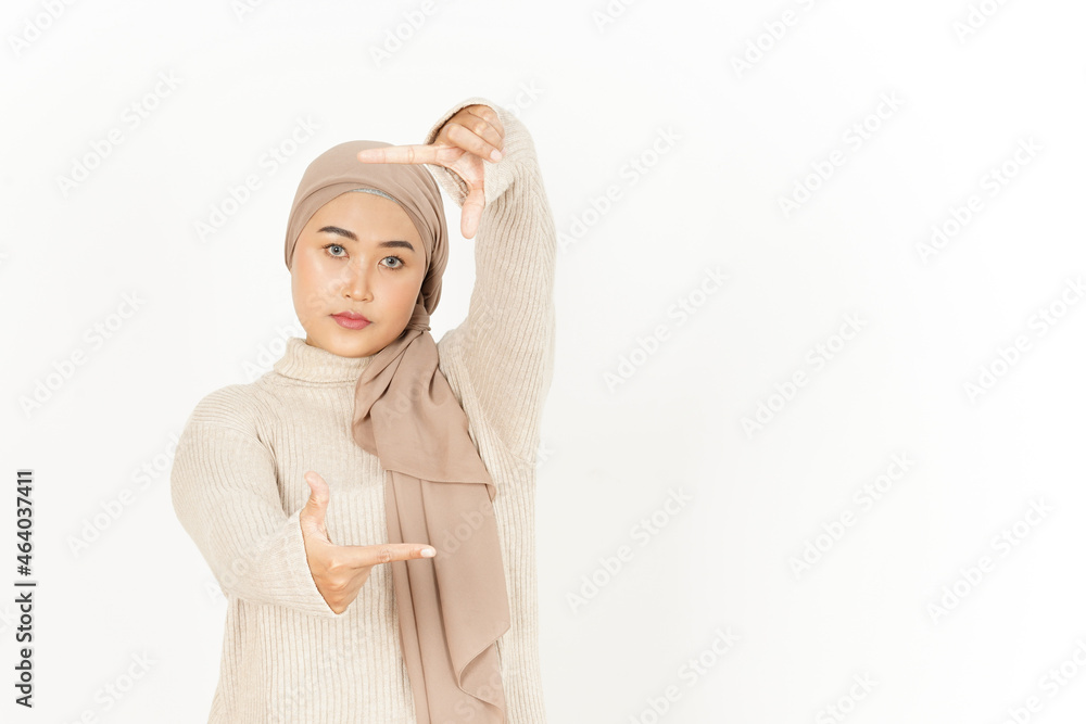 Making Frame with Hands of Beautiful Asian Woman Wearing Hijab Isolated On White Background Making Frame with Hands of Beautiful Asian Woman Wearing Hijab Isolated On White Background