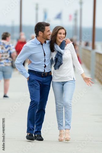 couple walking on pier