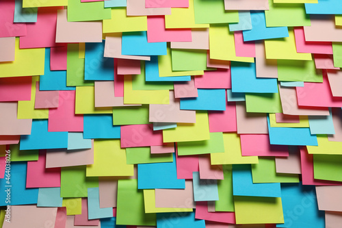 Colorful paper notes as background, closeup view