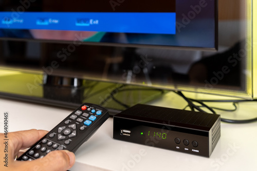 Digital decoder for new television transmission with remote control and television monitor.