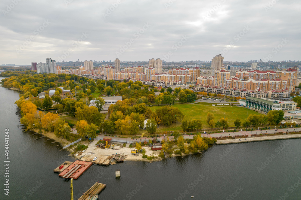 Aerial view of the city by the river in autumn