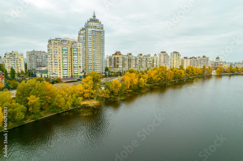 Aerial view of the city by the river in autumn photo