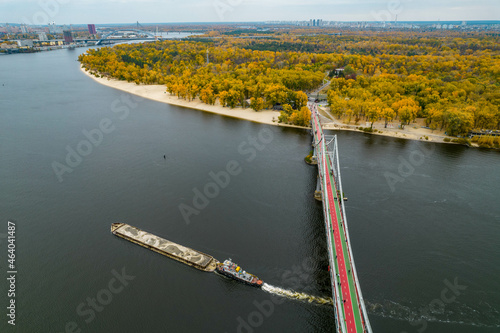 Aerial view of the bridge between the city and the park in autumn