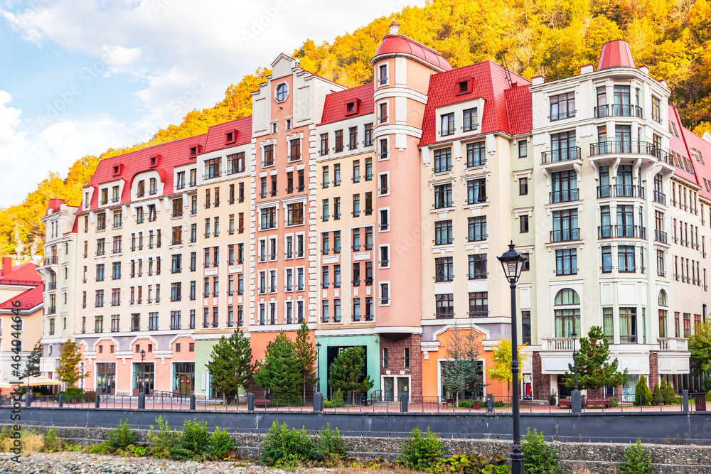 Fototapeta premium Colorful houses on the embankment in the Rosa Khutor resort.