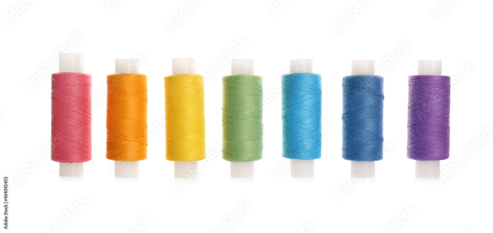 Set of colorful sewing threads on white background Set of colorful sewing threads on white background