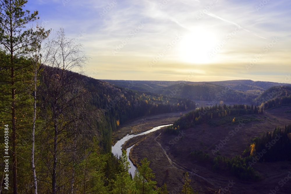 Sunset over Vakutin Kamen and the river valley of the Irgina River on an autumn day