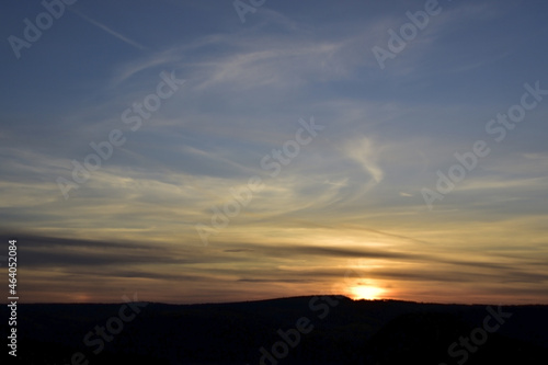 Autumn sunset in the blue sky