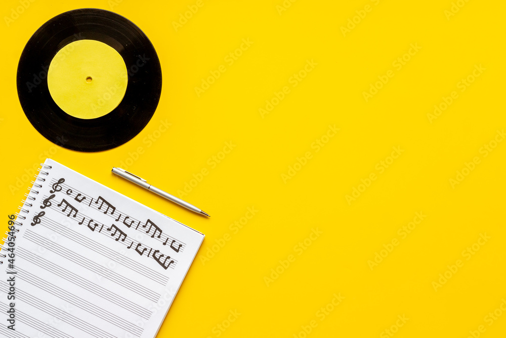 Music sheets with musical notes melody and vinyl record Music sheets with musical notes melody and vinyl record