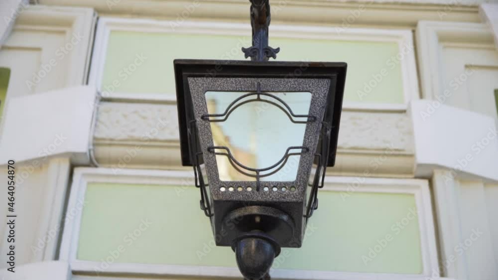 Street lighting. Lantern on the facade of the house. Lantern with a