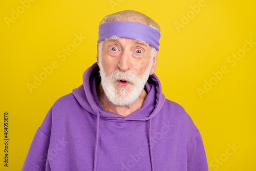 Photo of aged man omg wow reaction unexpected crazy staring fake news isolated over yellow color background