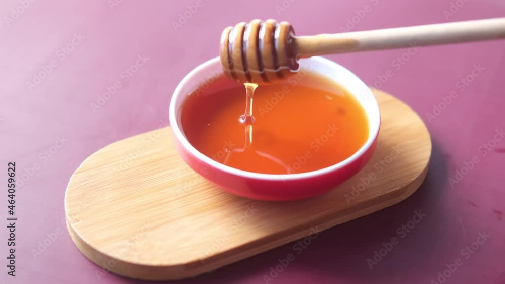 close up of fresh honey with spoon on table close up of fresh honey with spoon on table
