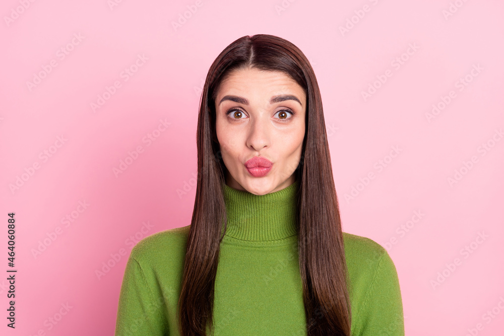 Photo of positive happy young woman smile good mood send air kiss charming isolated on pink color background
