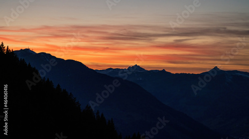 beautiful orange sunset on the mountains with view of the alps