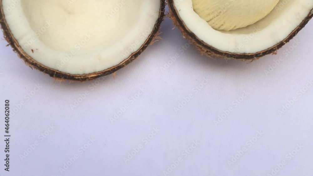 Close-up Video Shot Two slice Coconut on white Background Close-up Video Shot Two slice Coconut on white Background