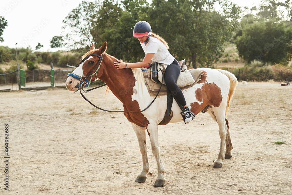 Girl riding on horse in countryside Girl riding on horse in countryside