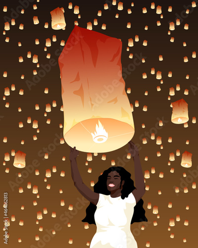 Woman releasing asian sky lantern 