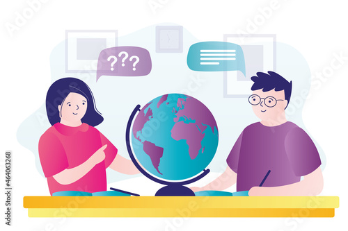 Teenagers in geography lesson study map of world. Students explore large globe in classroom