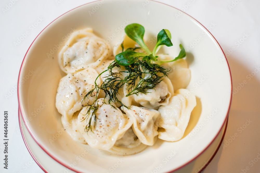 Dumplings with pepper and herbs close-up. Dumplings with pepper and herbs close-up.