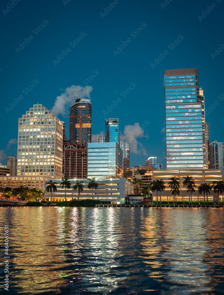 sunrise Brickell downtown city skyline Miami Florida reflections sea water buildings skyscrapers panorama 