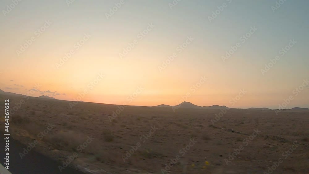 Beautiful views of volcanic landscape during a sunset in Lanzarote, Canary Islands, Spain during a road trip. Beautiful views of volcanic landscape during a sunset in Lanzarote, Canary Islands, Spain during a road trip.