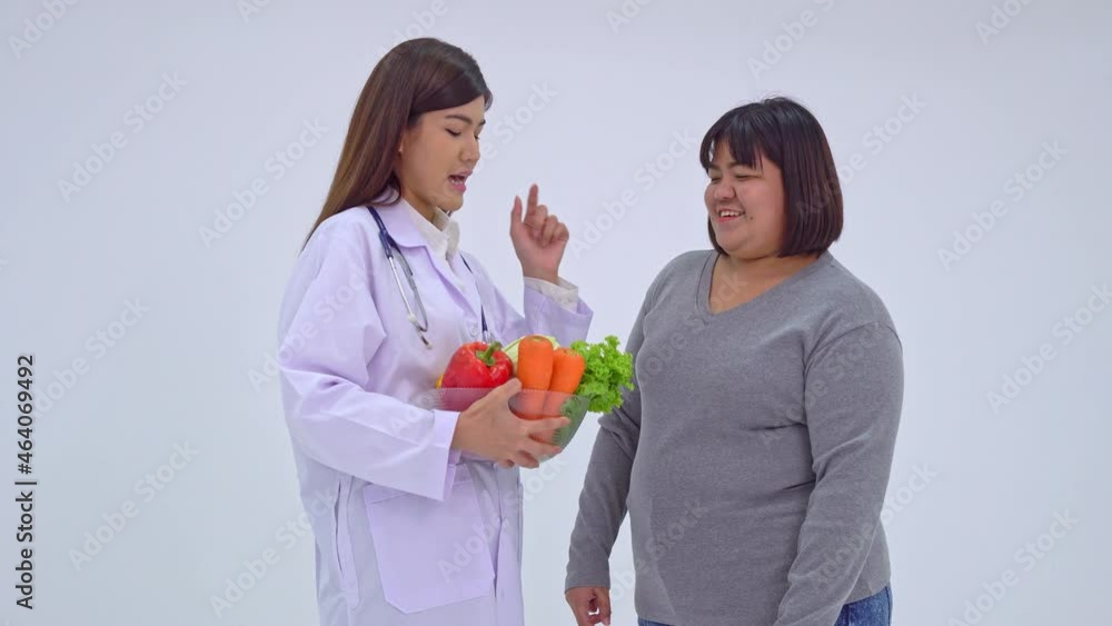 Doctor or nutritionist holding fresh fruit and introduce nutrition to patients. A healthy diet concept of nutrition food as a prescription for good health, the fruit is medicine. Doctor or nutritionist holding fresh fruit and introduce nutrition to patients. A healthy diet concept of nutrition food as a prescription for good health, the fruit is medicine.