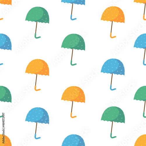 Umbrella seamless pattern. Cartoon colored umbrellas with polka dots on a white background.