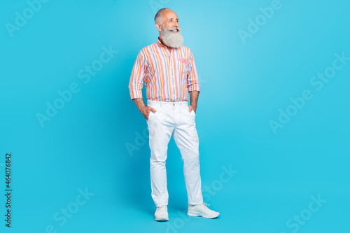 Full length photo of handsome aged man happy positive smile confident look empty space isolated over blue color background