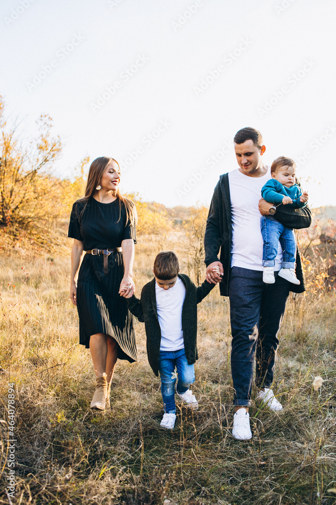 Young family with little son walking in park Young family with little son walking in park