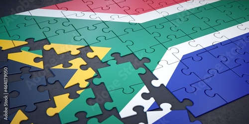 Messy pieces of puzzle with flag of South Africa.  photo