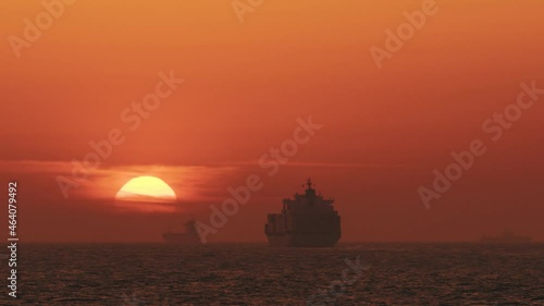 Ships near the Port of Rotterdam, by sunset. Maasvlakte 2, The Netherlands. photo