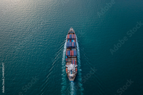 containers ship corgo transport floating at sea aerial top view © SHUTTER DIN